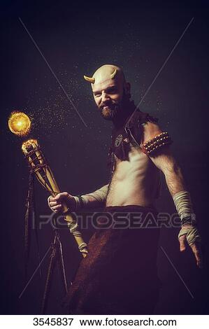 Creature holding a magic stick View Large Photo Image Stock Photo - Creature holding a magic stick. Fotosearch