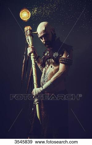 Creature holding a magic stick View Large Photo Image Stock Photo - Creature holding a magic stick. Fotosearch