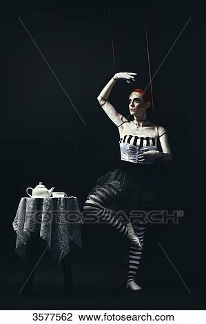 Dancing doll standing on one leg View Large Photo Image Stock Image - Dancing doll standing on one leg. Fotosearch