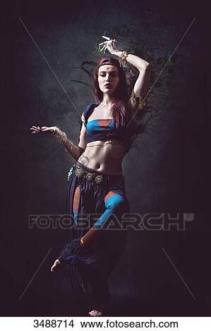 Dancing woman in ethnic dress View Large Photo Image Picture - Dancing woman in ethnic dress. Fotosearch