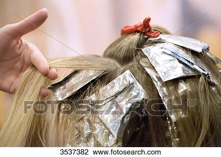 Stock Image - Dyeing hair strand. Fotosearch
