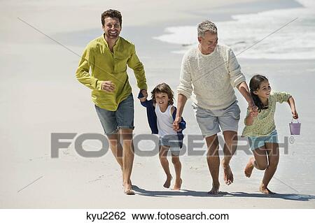 Family enjoying on the beach View Large Photo Image Stock Image - Family enjoying on the beach. Fotosearch