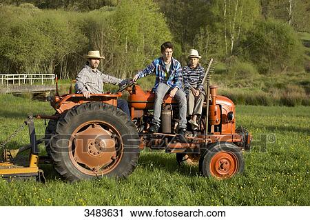Stock Image - Family on a tractor. Fotosearch