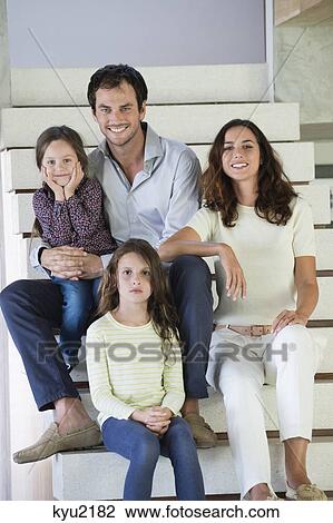 Family sitting on steps and smiling View Large Photo Image Stock Image - Family sitting on steps and smiling. Fotosearch