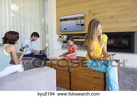 Family using electronics gadgets View Large Photo Image Picture - Family using electronics gadgets. Fotosearch