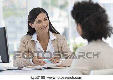 Female doctor showing medicine to a patient View Large Photo Image Stock Photography - Female doctor showing medicine to a patient. Fotosearch