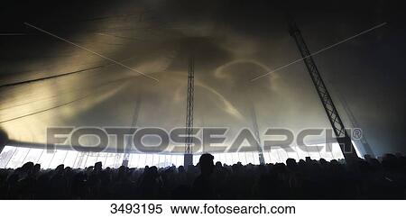 France, a crowd under a tent at the Hellfest festival. Backlighting effect View Large Photo Image Stock Photography - France, a crowd under a tent at the Hellfest festival. Backlighting effect. Fotosearch