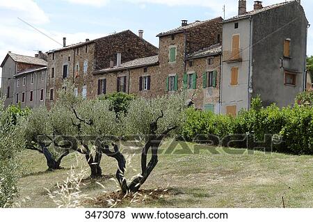 Stock Photo - France, Ardeche, Banne, landscape, the village in the new part of Banne, houses, olive trees. Fotosearch
