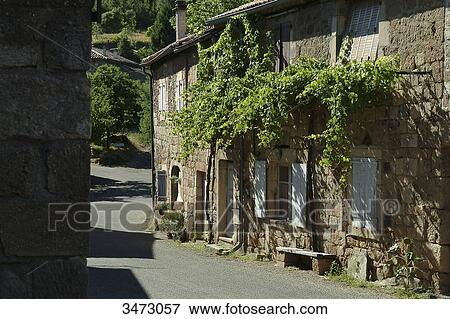 France, Ardeche, Bres, small street and houses in the village of Bres, facade with vine View Large Photo Image Stock Photo - France, Ardeche, Bres, small street and houses in the village of Bres, facade with vine. Fotosearch