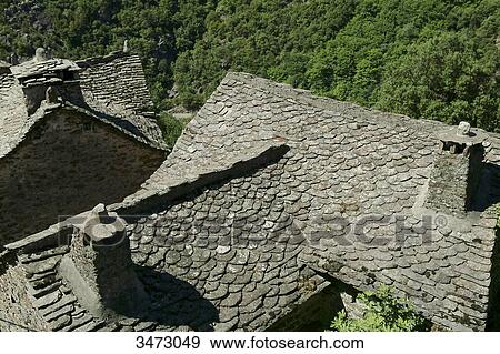 Stock Photo - France, Ardeche, Thines, flagstone roofs of the village of Thines. Fotosearch