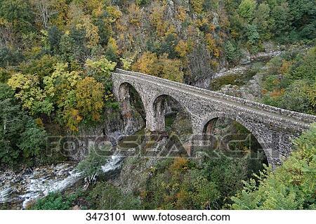 France, Ardeche, Valley of Lignon, basaltic flows, bridge over the river Lignon. View Large Photo Image Stock Image - France, Ardeche, Valley of Lignon, basaltic flows, bridge over the river Lignon.. Fotosearch