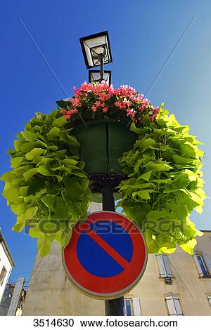 France, Ariege, flowered stret lamp and its sign no parking in one of the squares in Foix View Large Photo Image Stock Image - France, Ariege, flowered stret lamp and its sign no parking in one of the squares in Foix. Fotosearch