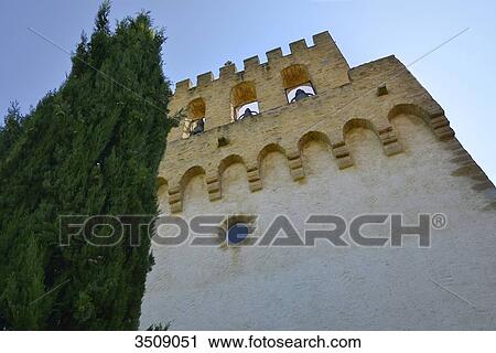 Stock Image - France, Ariege, front of the fortified church of Pujols. Fotosearch