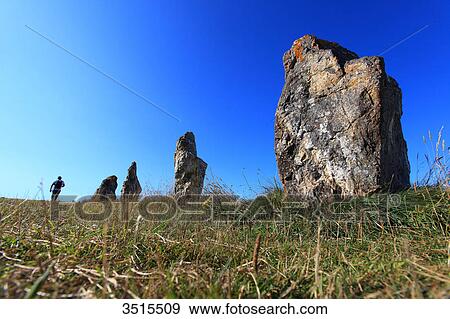 Stock Photo - France, Brittany, Crozon Peninsula. Camaret sur Mer. Line of standing stones (Lagatjar).. Fotosearch