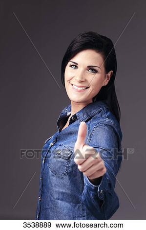 Stock Photo - France, brown young woman in studio. Fotosearch