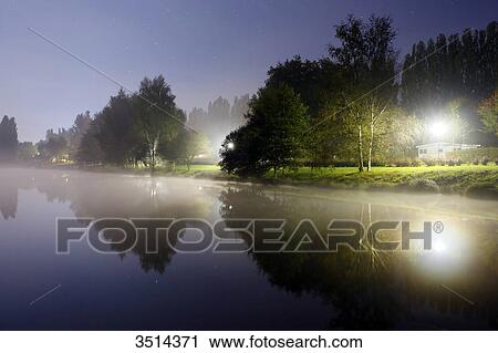 France, Burgundy, Yonne. Saint Sauveur in Puisaye. The pond of Joumiers by night, in lunar atmosphere. View Large Photo Image Stock Image - France, Burgundy, Yonne. Saint Sauveur in Puisaye. The pond of Joumiers by night, in lunar atmosphere.. Fotosearch