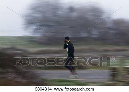 France, campagne, jogger in the wintertime. View Large Photo Image Picture - France, campagne, jogger in the wintertime.. Fotosearch