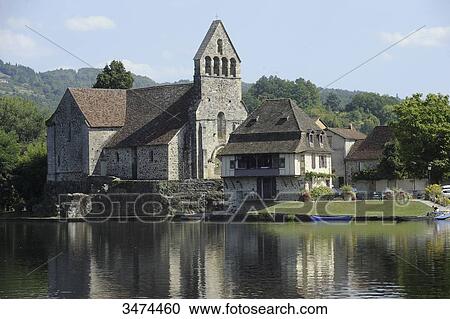 Stock Image - France, Center of France, Beaulieu-sur-Dordogne. The chapel penitent's on the riverbank, religious heritage, church. Fotosearch