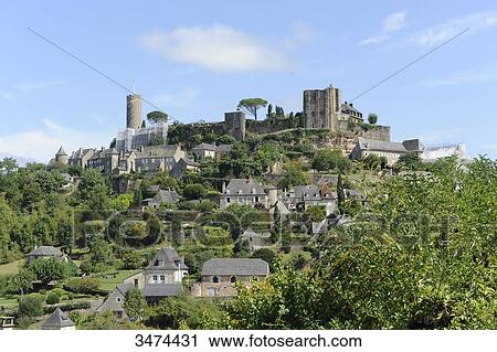 Stock Image - France, Center of France, Turenne, general view of the village of Turenne with the remnants of the castle and the tower ofTreasury. The castle has been dismantled by order of King Louis XV. Fotosearch