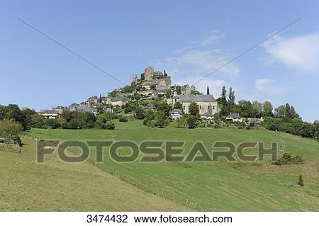 Stock Image - France, Center of France, Turenne, general view of the village of Turenne with the remnants of the castle and the tower of Treasury. The castle has been dismantled by order of Louis King XV. Fotosearch