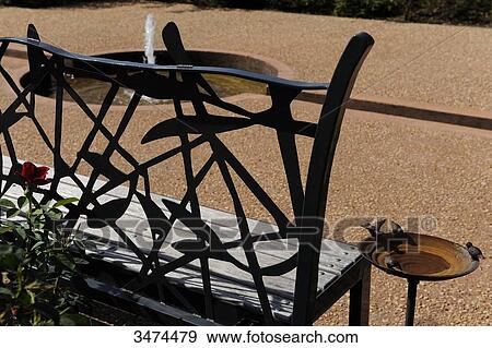Stock Photo - France, Center of France, Varetz, Colette's gardens, stroll in the writer's steps, drinking trough for birds in nutmeg climbing vine, Provenal garden. Fotosearch