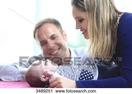 France, couple looking at baby View Large Photo Image Stock Image - France, couple looking at baby. Fotosearch