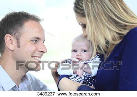 France, couple looking at baby View Large Photo Image Stock Photo - France, couple looking at baby. Fotosearch