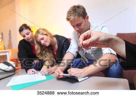 France, couple signing leasing agreement of apartment View Large Photo Image Stock Photo - France, couple signing leasing agreement of apartment. Fotosearch