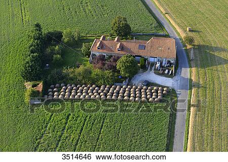 France, Dordogne, aerial view of a house in the middle of a field, surrounded by haystacks View Large Photo Image Stock Photograph - France, Dordogne, aerial view of a house in the middle of a field, surrounded by haystacks. Fotosearch