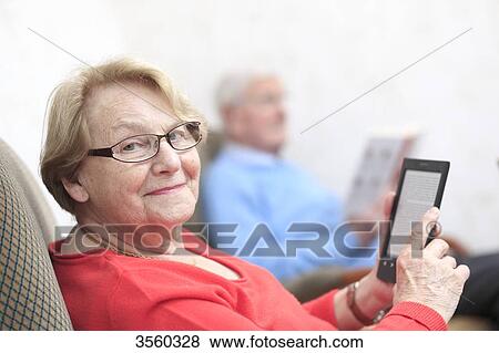 France, elderly and e-book View Large Photo Image Stock Photo - France, elderly and e-book. Fotosearch