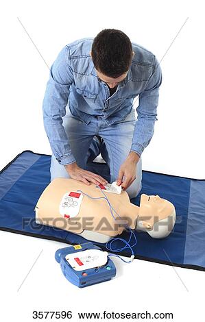 Stock Photograph - France, first aid on a mannequin. Fotosearch