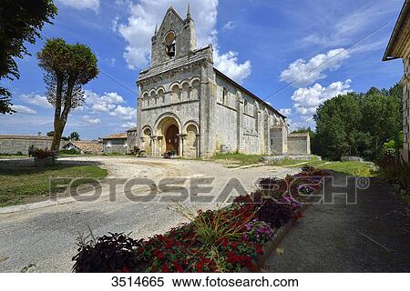France, Gironde, Church of Tauriac, under a blue sky. Flowerbed in the foreground View Large Photo Image Stock Photography - France, Gironde, Church of Tauriac, under a blue sky. Flowerbed in the foreground. Fotosearch