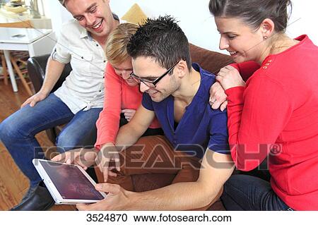 France, group of young people using digital tablet View Large Photo Image Stock Image - France, group of young people using digital tablet. Fotosearch