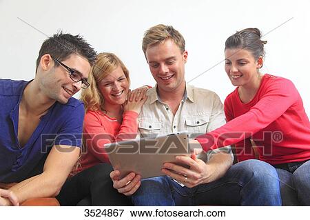 France, group of young people using digital tablet View Large Photo Image Stock Photo - France, group of young people using digital tablet. Fotosearch