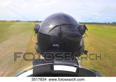 France, gyropter pilot. Blades reflecting on the helmet. View Large Photo Image Picture - France, gyropter pilot. Blades reflecting on the helmet.. Fotosearch