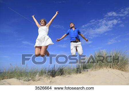 France, happy couple on beach View Large Photo Image Picture - France, happy couple on beach. Fotosearch