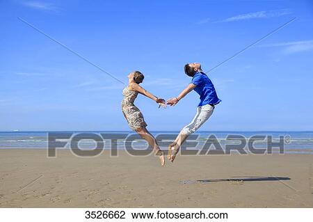 France, happy couple on beach View Large Photo Image Stock Image - France, happy couple on beach. Fotosearch