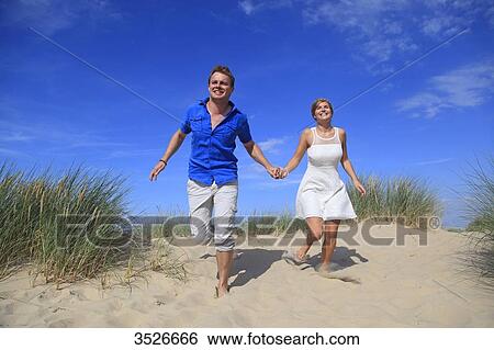 France, happy couple on beach View Large Photo Image Stock Photograph - France, happy couple on beach. Fotosearch