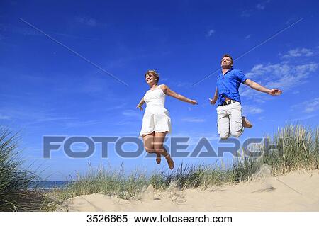 France, happy couple on beach View Large Photo Image Stock Photography - France, happy couple on beach. Fotosearch