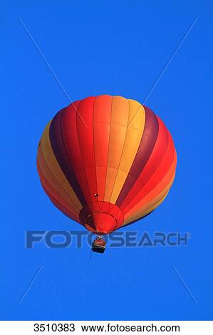 France, hot-air balloon in a blue sky View Large Photo Image Stock Image - France, hot-air balloon in a blue sky. Fotosearch
