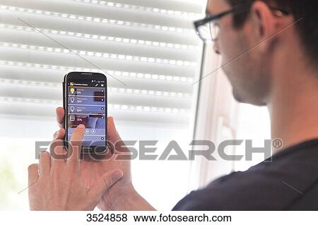 France, house automation starting from a smartphone View Large Photo Image Stock Photo - France, house automation starting from a smartphone. Fotosearch