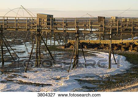 Stock Photo - France, Les Moutiers-en-Retz, frozen foam.. Fotosearch