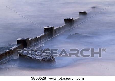 France, Les Moutiers-en-Retz, breakwater at the seashore. View Large Photo Image Stock Photo - France, Les Moutiers-en-Retz, breakwater at the seashore.. Fotosearch