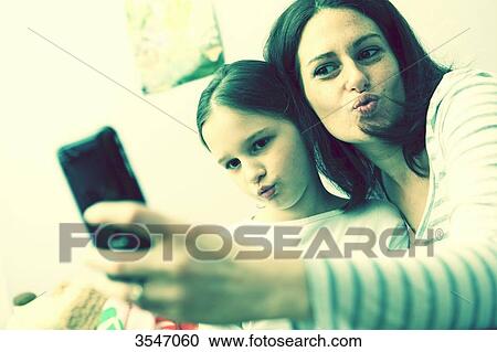 France, little girl and her mother at home, selfie View Large Photo Image Stock Image - France, little girl and her mother at home, selfie. Fotosearch