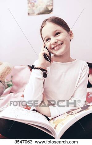 France, little girl at home using smartphone View Large Photo Image Stock Image - France, little girl at home using smartphone. Fotosearch