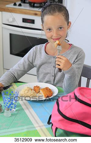 France, little girl eating breaded chicken View Large Photo Image Stock Photo - France, little girl eating breaded chicken. Fotosearch