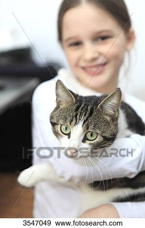 France, little girl, with cat at home View Large Photo Image Stock Photo - France, little girl, with cat at home. Fotosearch