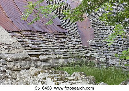 France, Lozere, old stone wall and stone tiles roof View Large Photo Image Stock Photo - France, Lozere, old stone wall and stone tiles roof. Fotosearch