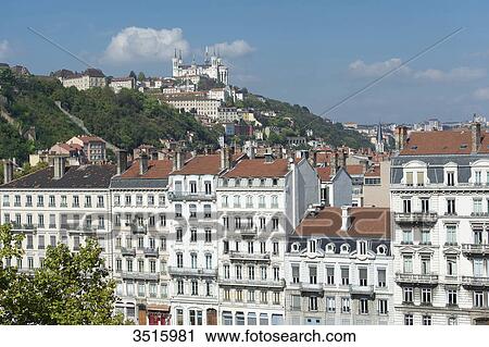 Stock Image - France. Lyon. Facades of buildings quay Fulchiron and the basilica Notre-Dame of Fourviere. Fotosearch
