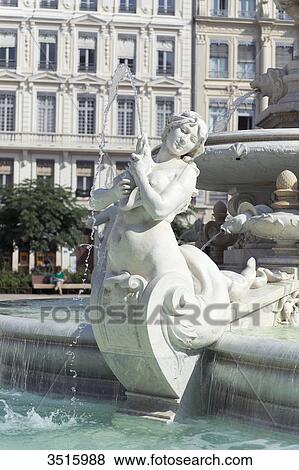 Stock Photo - France. Lyon. Fountain of the Place des Jacobins ( 1885 ) Detail of a statue of a mermaid. Fotosearch